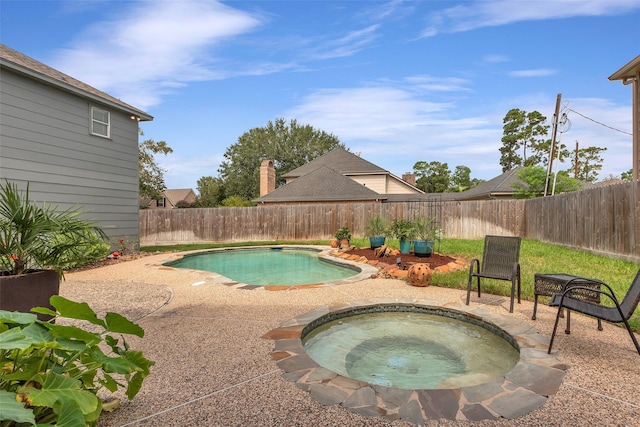 view of pool featuring a patio area, a fenced backyard, a fenced in pool, and an in ground hot tub