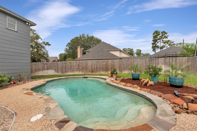 view of swimming pool featuring a fenced backyard and a fenced in pool