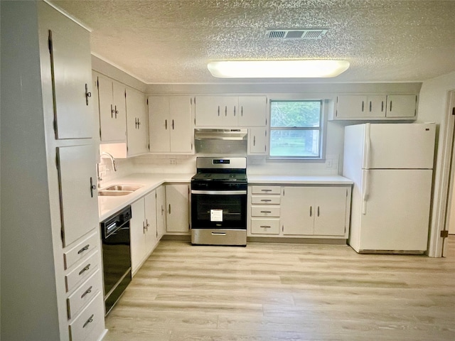 kitchen featuring stainless steel stove, white refrigerator, white cabinetry, and black dishwasher