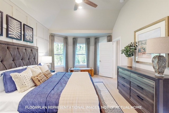 bedroom featuring lofted ceiling, ceiling fan, and light hardwood / wood-style floors