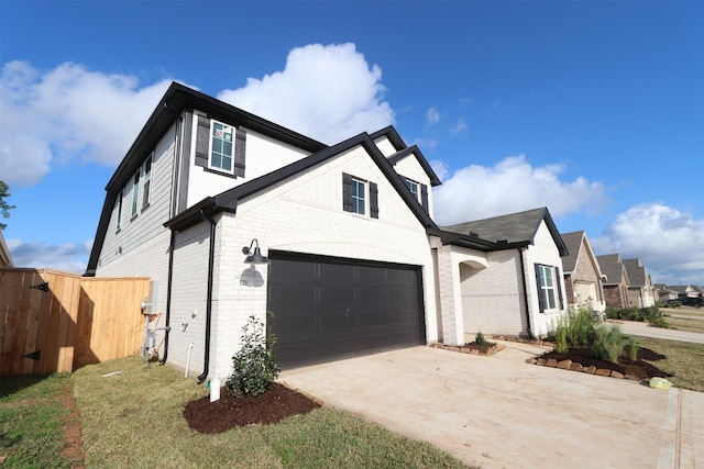 view of front facade with a garage and a front yard