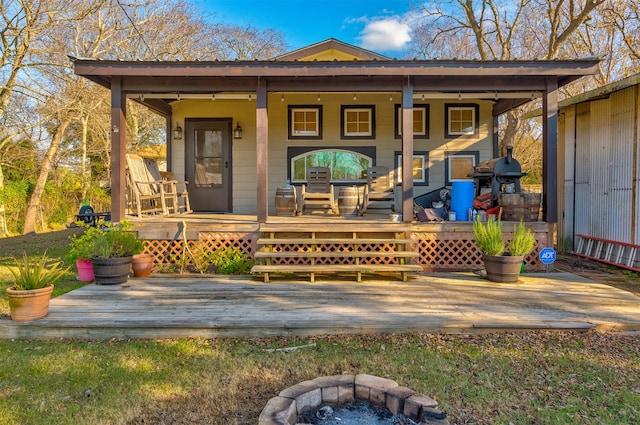 exterior space with a deck and covered porch