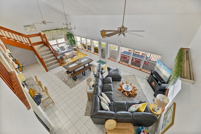 tiled living room featuring high vaulted ceiling and ceiling fan