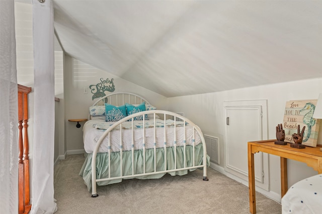 carpeted bedroom featuring lofted ceiling