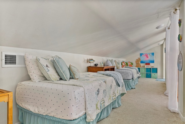 carpeted bedroom with lofted ceiling