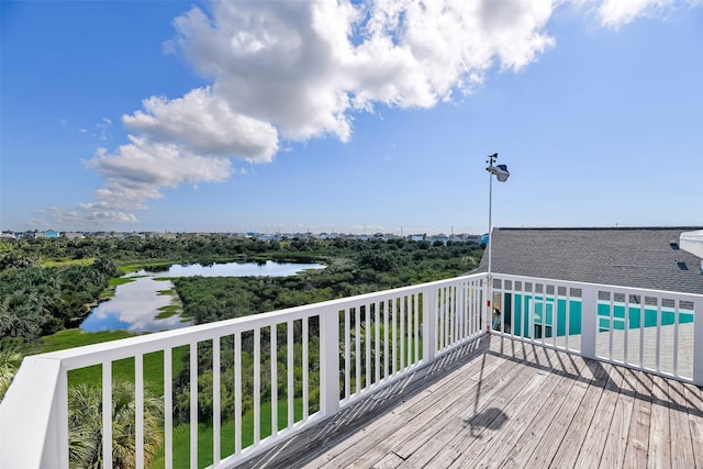 wooden deck with a water view