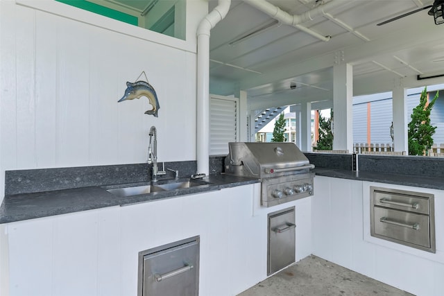 view of patio featuring sink, a grill, and exterior kitchen