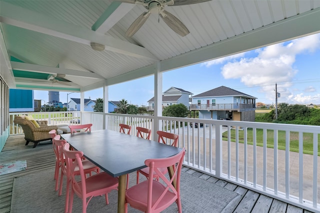 view of patio with ceiling fan and a deck