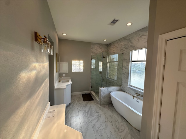 bathroom with shower with separate bathtub, vanity, and plenty of natural light