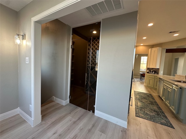 interior space featuring wood-type flooring and vanity