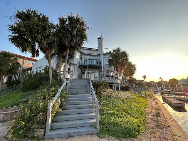 view of back house at dusk