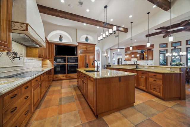 kitchen featuring custom range hood, a sink, a spacious island, and beamed ceiling