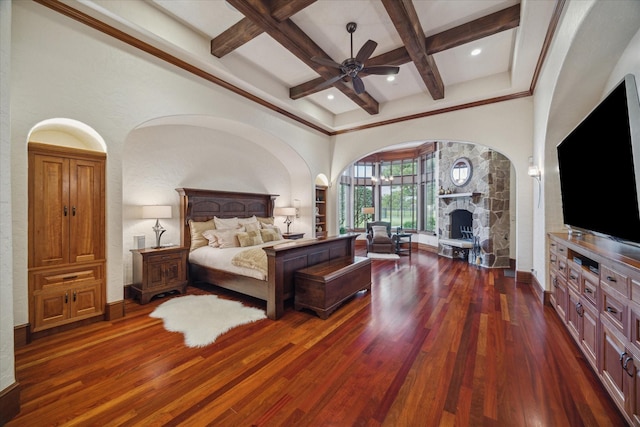 bedroom featuring arched walkways, beamed ceiling, coffered ceiling, and dark wood-type flooring