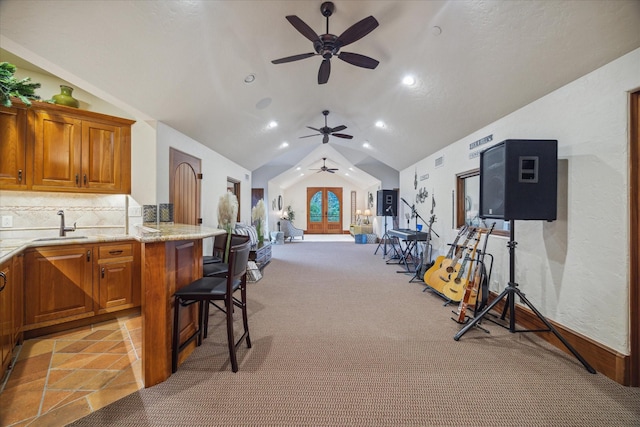 interior space featuring visible vents, a ceiling fan, outdoor wet bar, french doors, and a sink
