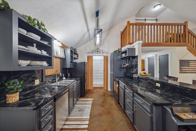 kitchen featuring backsplash, decorative light fixtures, open shelves, a sink, and stainless steel appliances