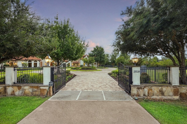view of gate with fence