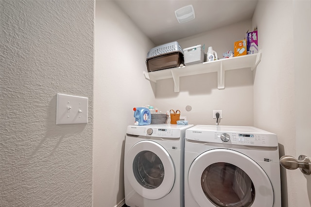 clothes washing area featuring washing machine and clothes dryer