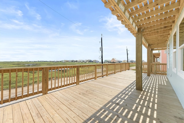 wooden terrace featuring a yard