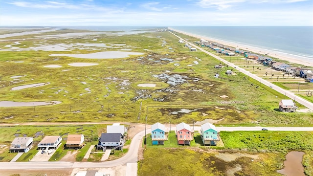 aerial view with a beach view and a water view