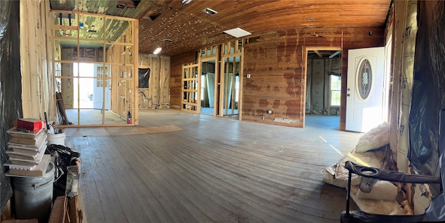 interior space featuring lofted ceiling, hardwood / wood-style floors, and wood ceiling