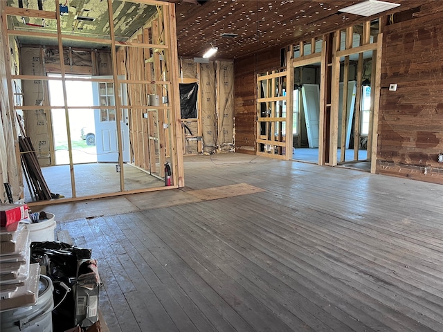 miscellaneous room with wood walls and hardwood / wood-style floors