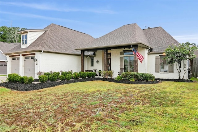 view of front of property with a garage and a front yard