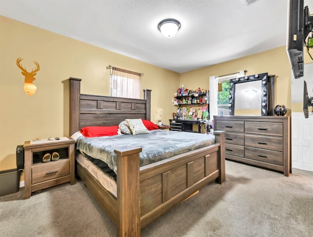 carpeted bedroom with a textured ceiling