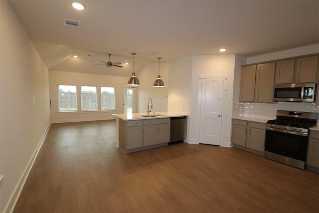 kitchen featuring gray cabinets, appliances with stainless steel finishes, pendant lighting, sink, and kitchen peninsula