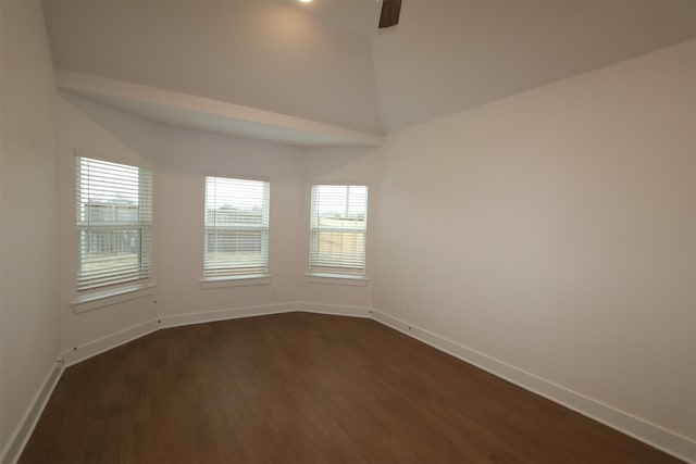 spare room with ceiling fan, lofted ceiling, and dark hardwood / wood-style flooring