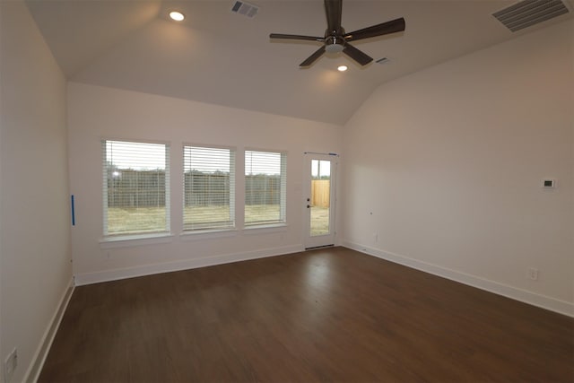 spare room featuring lofted ceiling, dark wood-type flooring, and ceiling fan