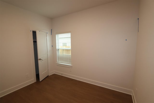 unfurnished room featuring dark hardwood / wood-style floors