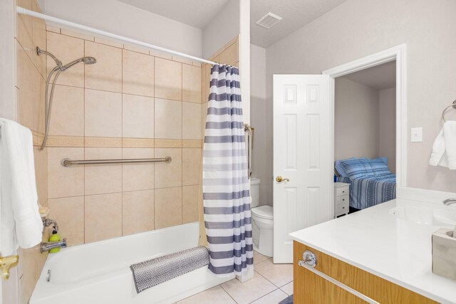 full bathroom featuring shower / bath combination with curtain, vanity, toilet, and tile patterned floors