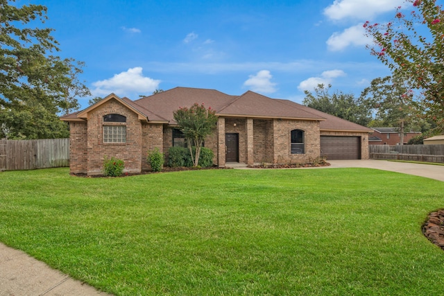 single story home featuring a garage and a front lawn