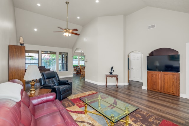 living room featuring ceiling fan, dark hardwood / wood-style flooring, and high vaulted ceiling