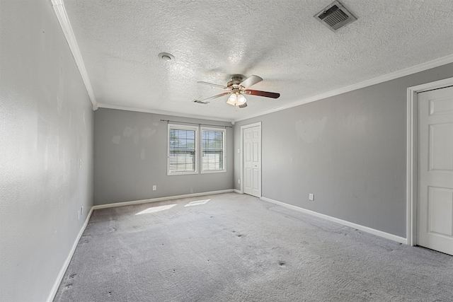 unfurnished room featuring light carpet, a textured ceiling, ornamental molding, and ceiling fan