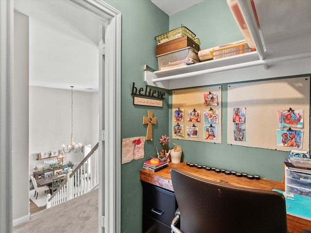 home office featuring carpet and a notable chandelier