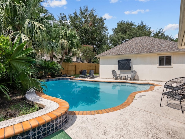 view of pool with fence, a fenced in pool, and a patio