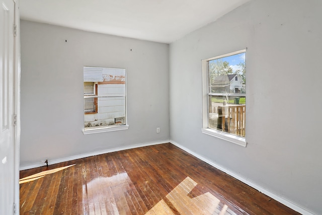 unfurnished room featuring dark hardwood / wood-style floors