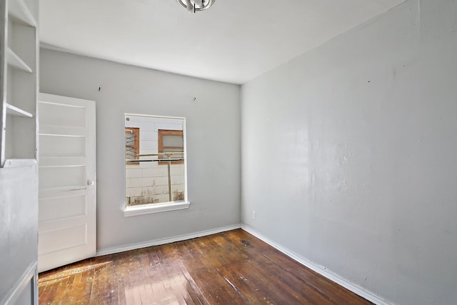 spare room featuring dark hardwood / wood-style flooring