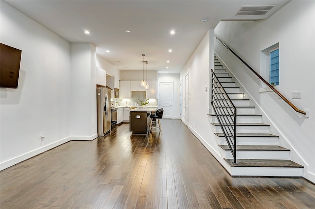 interior space with hardwood / wood-style floors