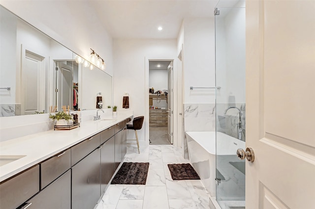 bathroom featuring vanity and separate shower and tub