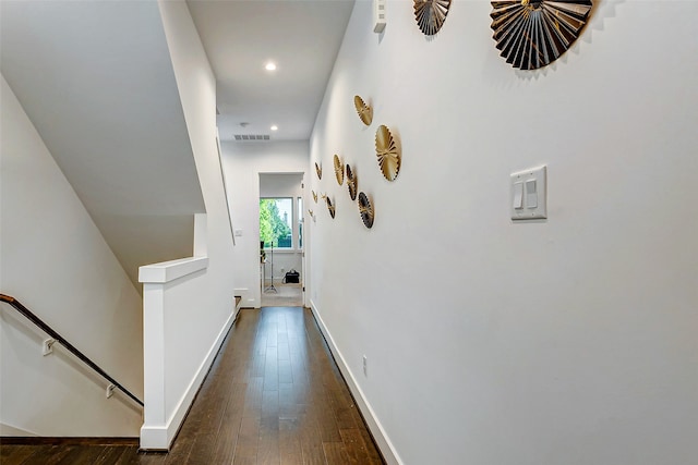 hall with dark hardwood / wood-style flooring