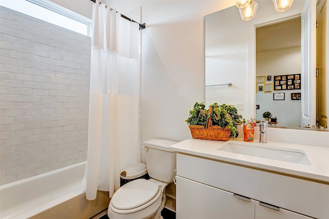 full bathroom with vanity, toilet, and shower / tub combo with curtain