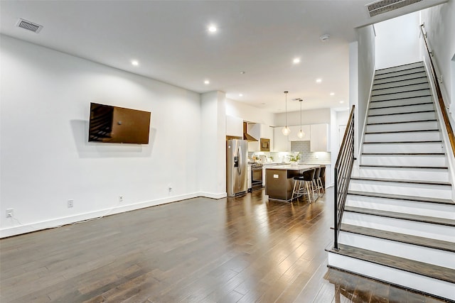 living room featuring dark hardwood / wood-style floors