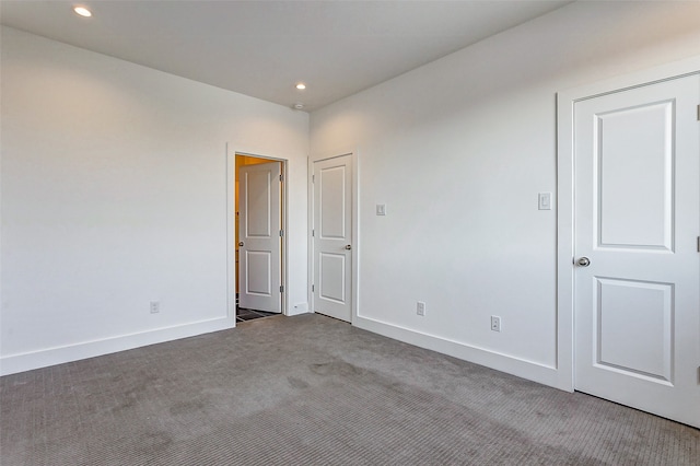 spare room featuring carpet floors