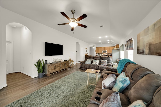 living room with vaulted ceiling, ceiling fan, and hardwood / wood-style floors