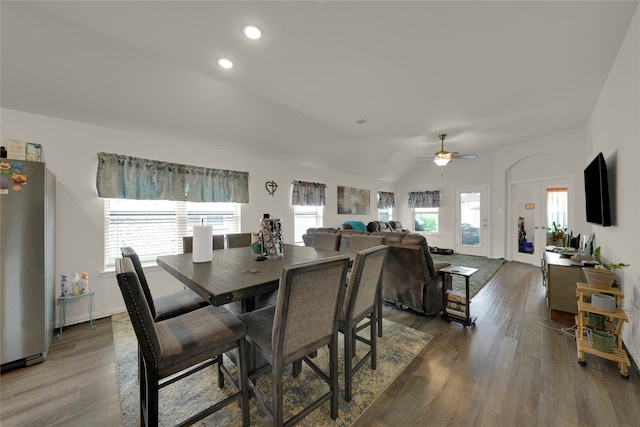 dining space featuring vaulted ceiling, ceiling fan, and dark hardwood / wood-style flooring