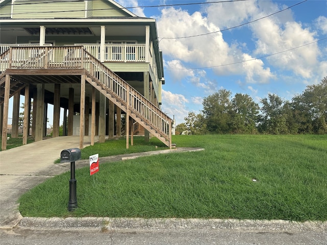 exterior space with a lawn and a carport