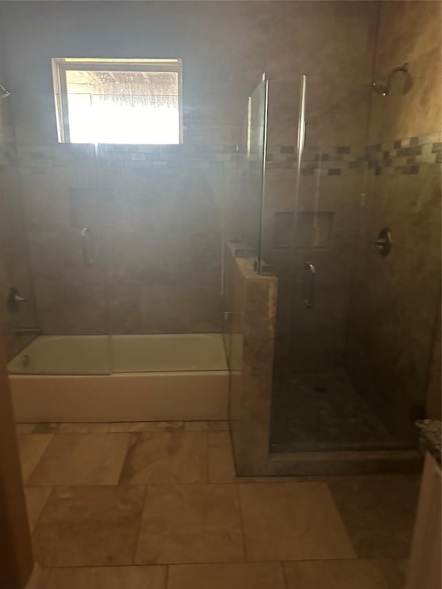 bathroom featuring independent shower and bath and tile patterned floors