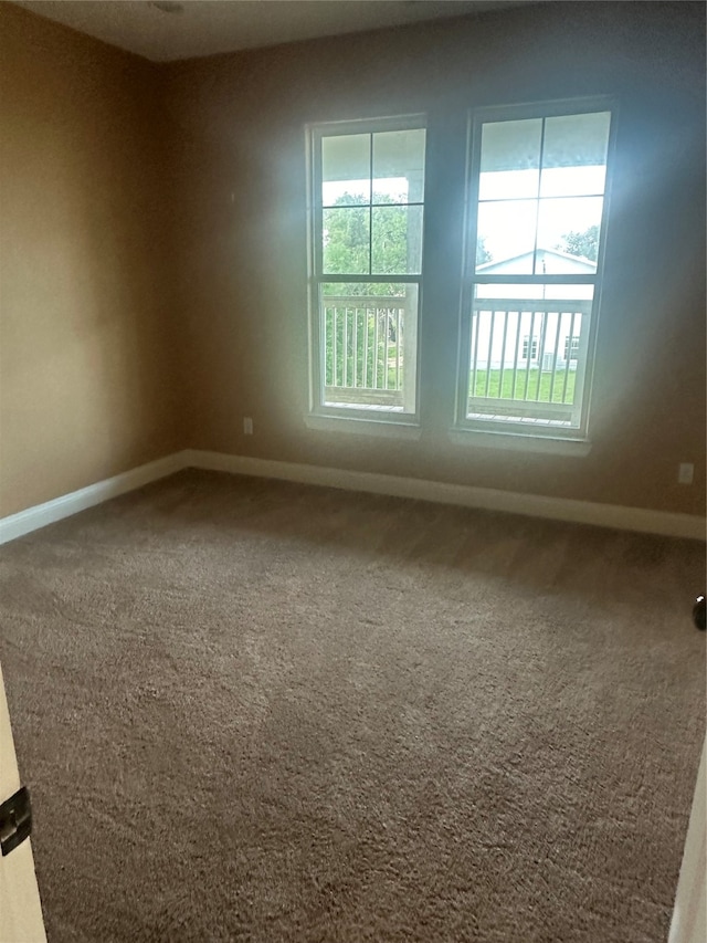 empty room featuring carpet flooring